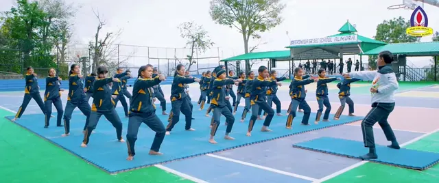 Students in a martial-arts session on the school courts